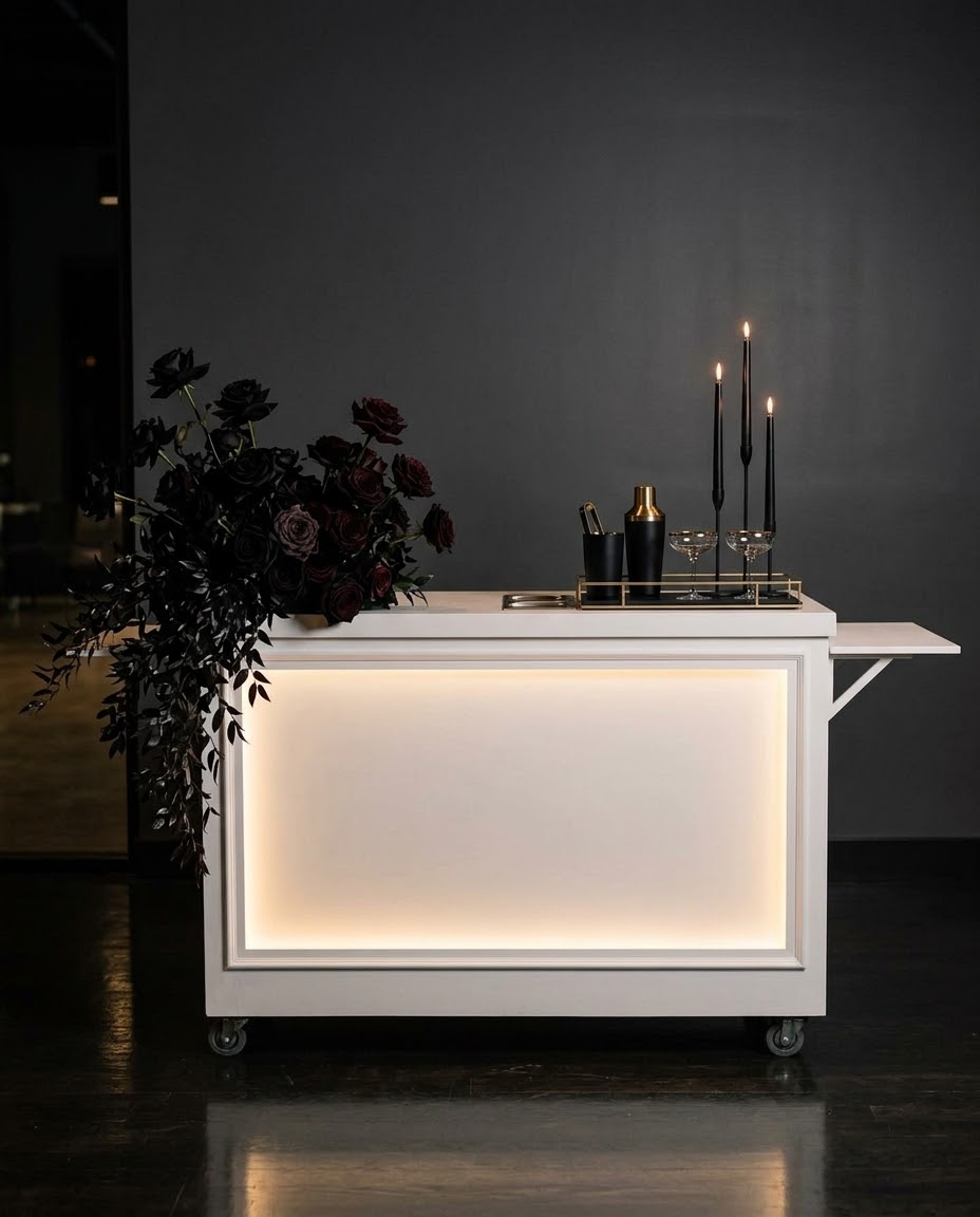 White mobile event cart with a lit front panel set up for a corporate event in Edmonton